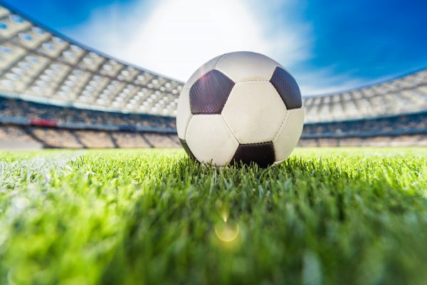 close-up-view-of-soccer-ball-on-grass-on-soccer-field-stadium.jpg